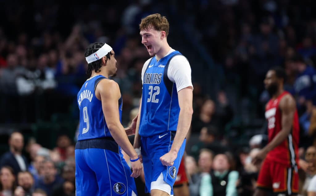 Dallas Mavericks forward Cooper Flagg celebrates with guard Ryan Nembhard during a December 2025 game