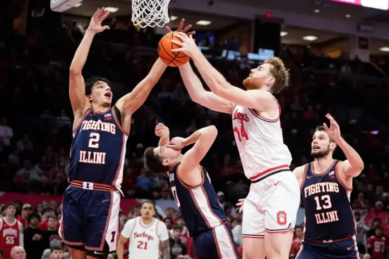 Ohio State Buckeyes forward Brandon Noel (14) makes contact with Illinois Fighting Illini forward David Mirkovic (0) as he attempts a rebound beside Ohio State Buckeyes guard Bruce Thornton (2) during the second half of the NCAA men's basketball game in Columbus on Dec. 9, 2025. Ohio State lost 86-78.