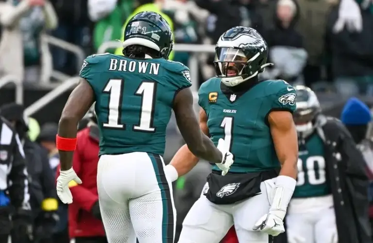 Eagles Jalen Hurts and AJ Brown Celebrating a Late Touchdown vs Raiders