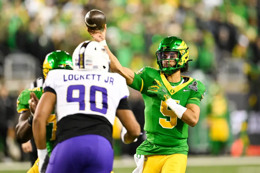 Oregon QB Dante Moore throws a pass vs JMU