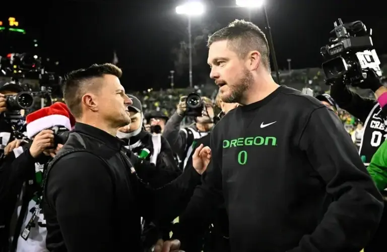 Oregon Head Coach Dan Lanning Shaking the hand of JMU Head Coach Bob Chensey after the Game