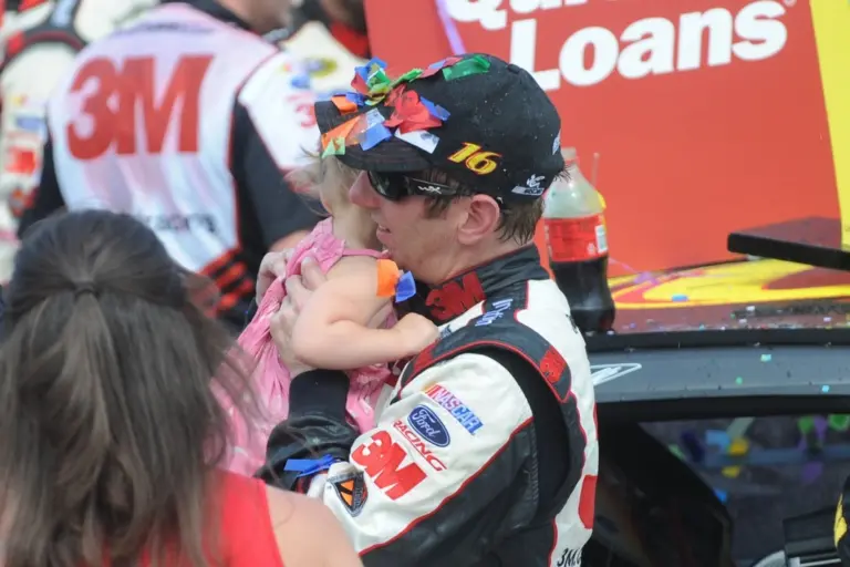 Jun 16, 2013; Brooklyn, MI, USA; NASCAR Sprint Cup Series driver Greg Biffle (16) and his daughter Emma after winning the Quicken Loans 400 at Michigan International Speedway. Mandatory Credit: Randy Sartin-Imagn Imagescx