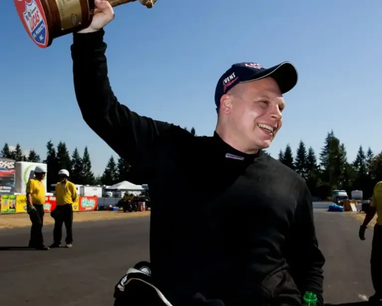 Aug. 4, 2013; Kent, WA, USA: NHRA top alcohol dragster driver Shawn Cowie celebrates after winning the Northwest Nationals at Pacific Raceways. Mandatory Credit: Mark J. Rebilas-Imagn Images