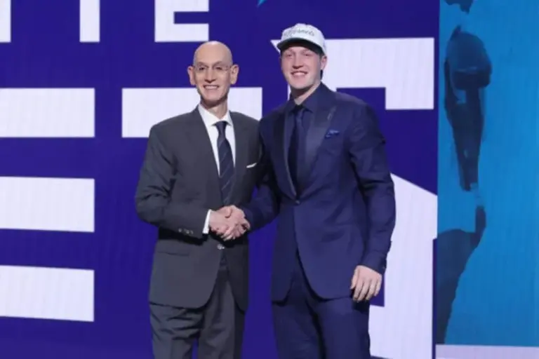 Jun 25, 2025; Brooklyn, NY, USA; Kon Knueppel stands with NBA commissioner Adam Silver after being selected as the fourth pick by the Charlotte Hornets in the first round of the 2025 NBA Draft at Barclays Center.