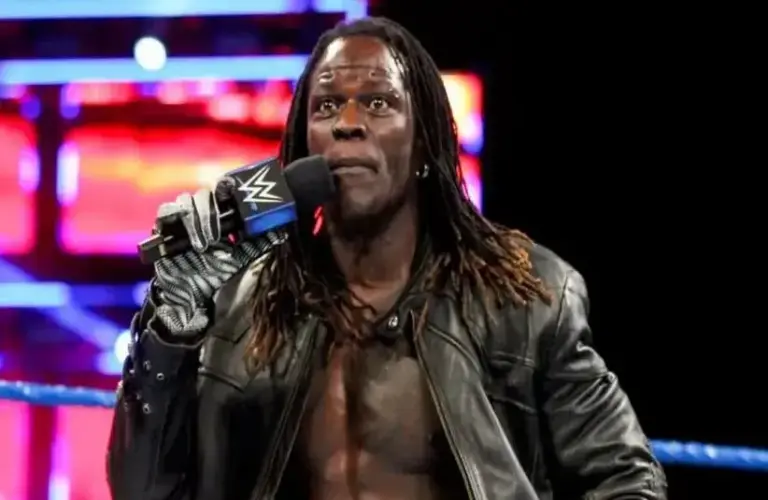 R-Truth WWE Holding Microphone in the middle of the ring