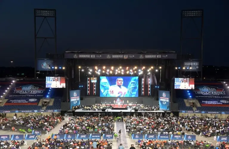 Ty Law speaks during the Pro Football Hall of Fame Enshrinement at Tom Benson Hall of Fame Stadium