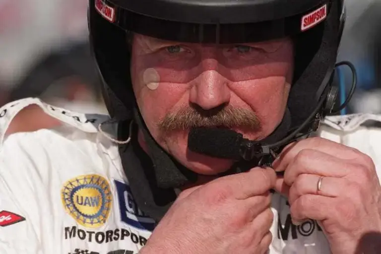 Dale Earnhardt, Sr. adjusts his helmet during testing at the Daytona International Speedway, January 5, 2001.