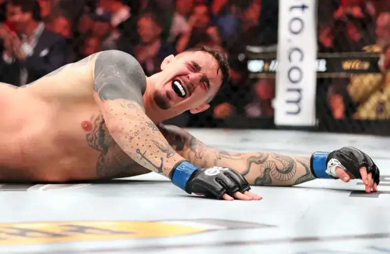 Tom Aspinall (blue gloves) UFC 295