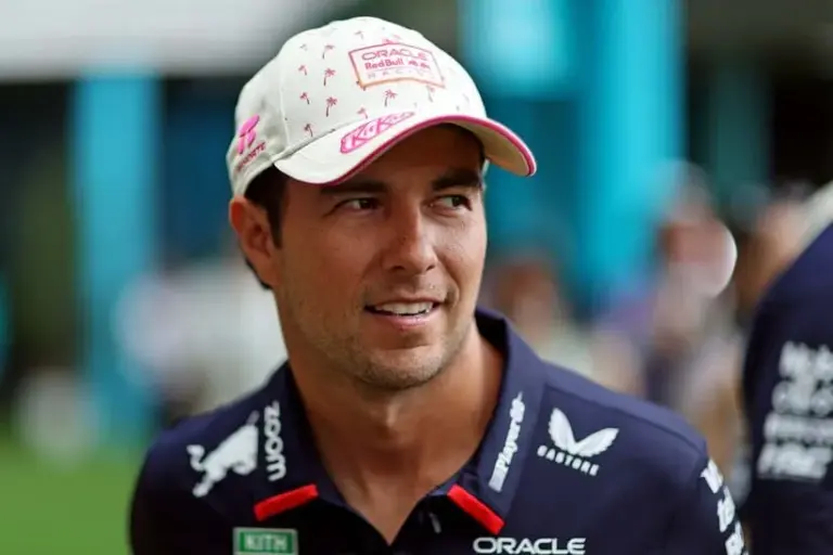 May 5, 2024; Miami Gardens, Florida, USA; Red Bull Racing driver Sergio Perez (11) walks in the paddock before the F1 Miami Grand Prix at Miami International Autodrome. Mandatory Credit: