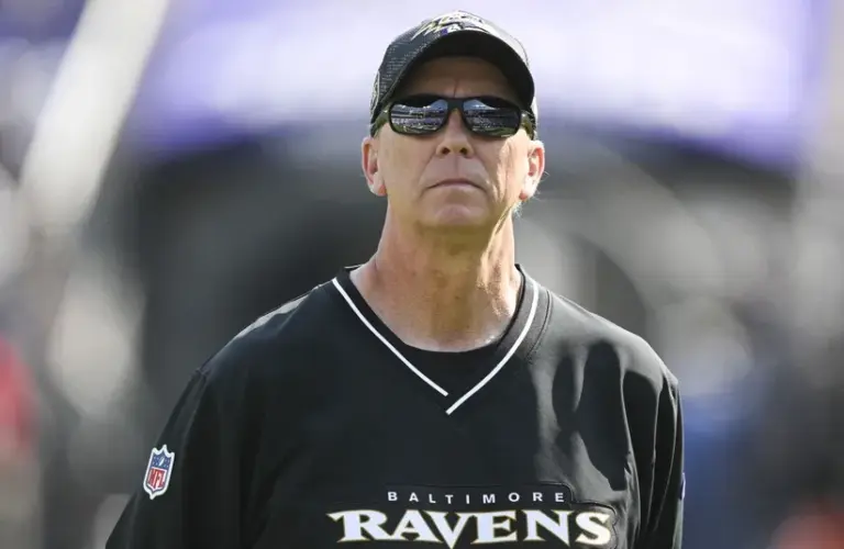 Baltimore Ravens offensive coordinator Todd Monken on the field before the game against the Washington Commanders at M&T Bank Stadium.