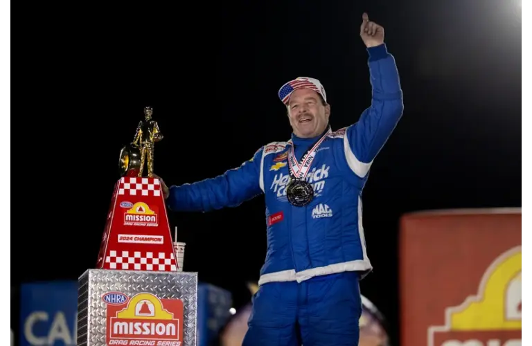 Nov 17, 2024; Pomona, CA, USA; NHRA pro stock driver Greg Anderson celebrates after winning the race to clinch his sixth carer pro stock world championship during the NHRA Finals at In-N-Out Burger Pomona Dragstrip. Top 75