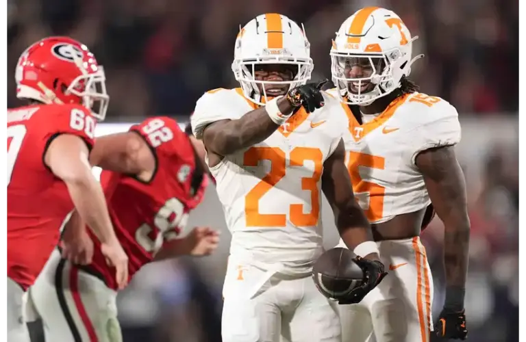 Tennessee defensive back Boo Carter celebrates with Edrees Farooq after returning a punt during