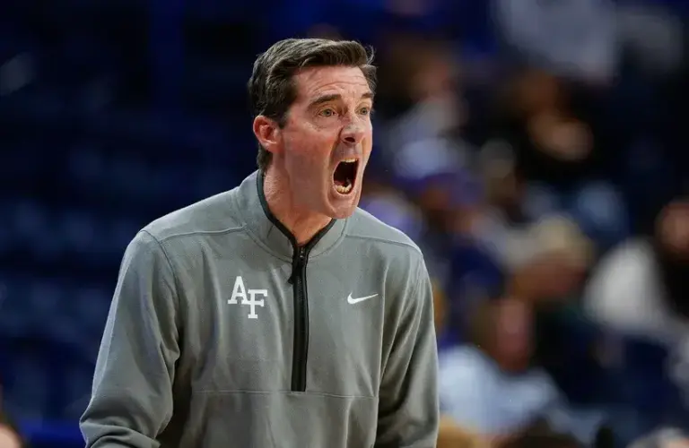 Air Force Academy Basketball Head Coach Joe Scott coaching during San Jose State game.