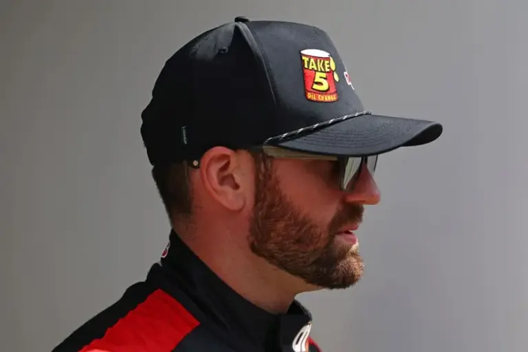 Feb 16, 2025; Daytona Beach, Florida, USA; NASCAR Cup Series driver Corey LaJoie (01) walks to the drivers meeting before the Daytona 500 at Daytona International Speedway.