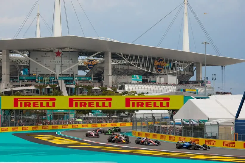 May 4, 2025; Miami Gardens, FL, USA; Williams driver Carlos Sainz (55) races ahead of Ferrari driver Charles Leclerc (16) during the F1 Miami Grand Prix at Miami International Autodrome.