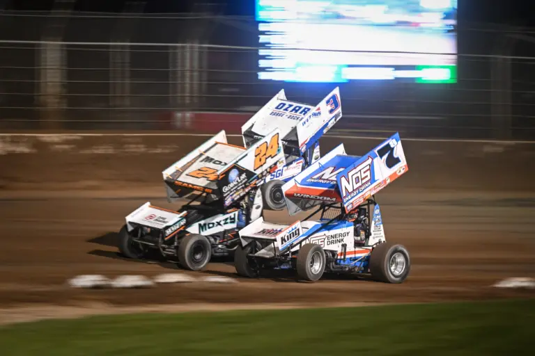 Tulsa; Chris Windom (7S), Danny Sams III (24D) and Ayrton Gennetten (3) race through Turn 2 in the feature at the World of Outlaws sprint car event Friday, June 6, 2025, at the Plymouth Dirt Track in Plymouth, Wisconsin.