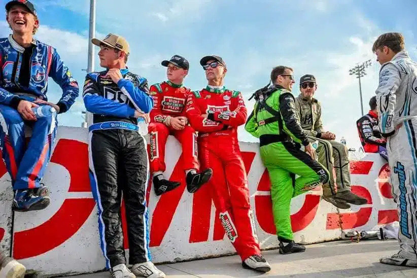 Former NASCAR Cup Series champion Kevin Harvick, center, right, and his son Keelan, 13, look on before the two raced in the 13th annual Masters of the Pros 200 race on Wednesday, July 16, 2025, at the Owosso Speedway.