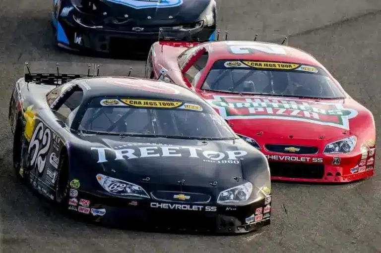 Keelan Harvick, left, and his father former NASCAR Cup Series champion Kevin Harvick, right, race in the 13th annual Masters of the Pros 200 race on Wednesday, July 16, 2025, at the Owosso Speedway.