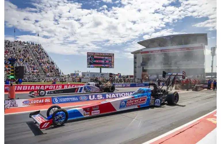 Aug 30, 2025; Clermont, IN, USA; NHRA top fuel driver Tony Stewart (near) races alongside Tony Schumacher during qualifying for the US Nationals at Lucas Oil Indianapolis Raceway Park.