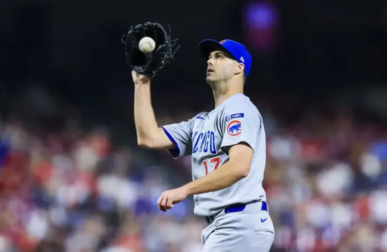 Chicago Cubs relief pitcher Taylor Rogers (17) fields the ball.