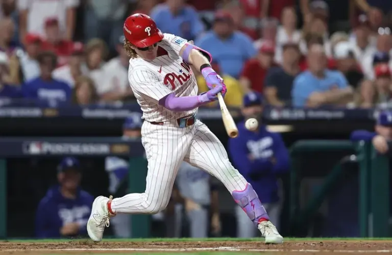 Philadelphia Phillies left fielder Harrison Bader (2) hits an RBI sacrifice fly against the Los Angeles Dodgers in the second inning during game one of the NLDS