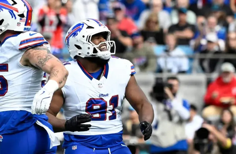 Buffalo Bills defensive tackle Ed Oliver (91) reacts after a sack in the first quarter at Bank of America Stadium.