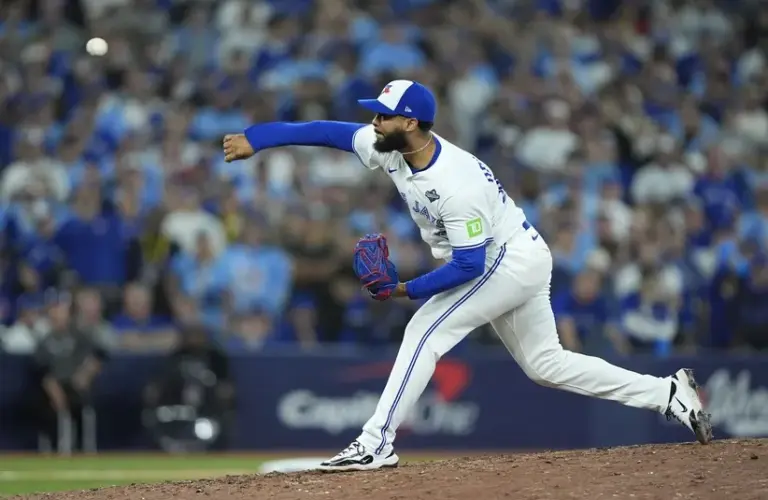 Toronto Blue Jays pitcher Seranthony Dominguez (48) pitches against the Los Angeles Dodgers in the tenth inning during game seven of the 2025 MLB World Series at Rogers Centre.