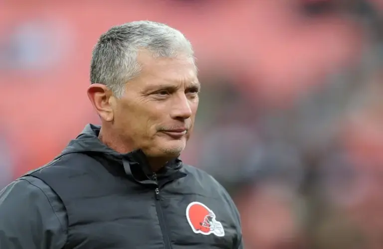 Cleveland Browns defensive coordinator Jim Schwartz watches the team warm up before an NFL football game at Huntington Bank Field