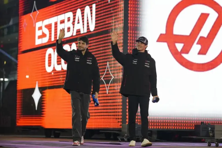 Nov 22, 2025; Las Vegas, NV, USA; Haas F1 Team driver Esteban Ocon (31), left, and Haas F1 Team driver Oliver Bearman (87) arrive for the Las Vegas Grand Prix drivers parade at the Las Vegas Strip Circuit.