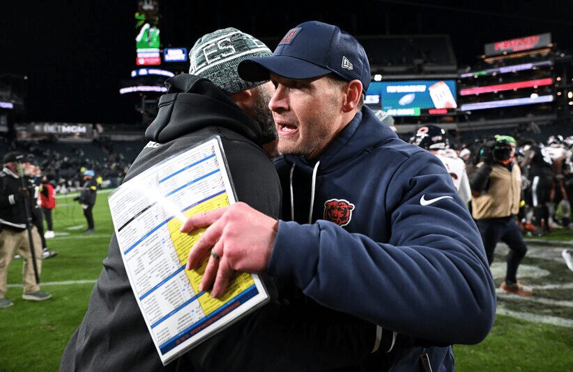 Chicago Bears Ben Johnson metting for post game handshake.
