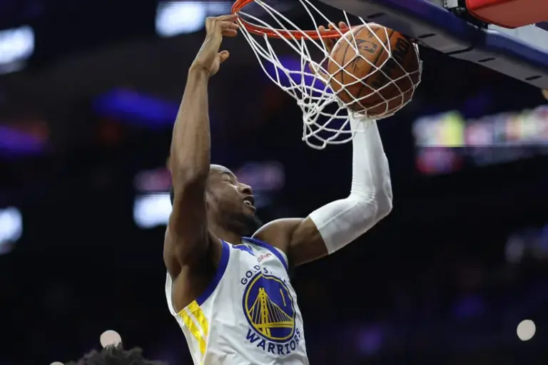 Philadelphia, Pennsylvania, USA; Golden State Warriors forward Jonathan Kuminga (1) dunks the ball against the Philadelphia 76ers during the third quarter at Xfinity Mobile Arena.