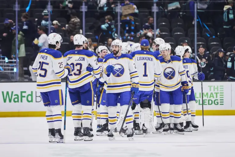 Dec 14, 2025; Seattle, Washington, USA; The Buffalo Sabres celebrate after the game against the Seattle Kraken at Climate Pledge Arena.