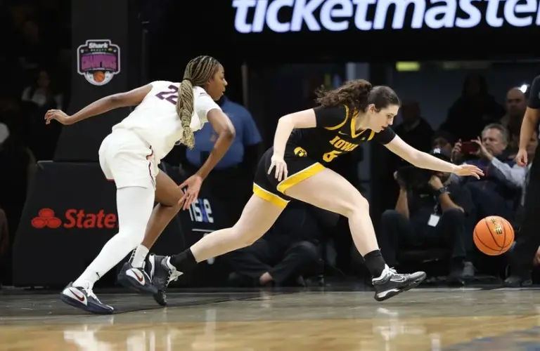 UConn Huskies forward Serah Williams (22) and Iowa Hawkeyes guard Ava Heiden (5) chase after the ball during the second half at Barclays Center.