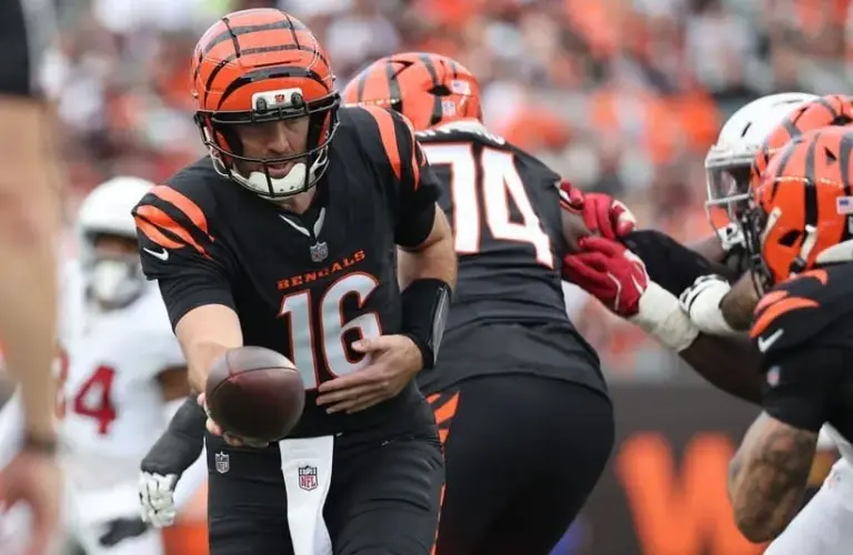Cincinnati Bengals quarterback Joe Flacco (16) hands off during the second half against the Arizona Cardinals at Paycor Stadium.