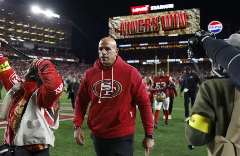San Francisco 49ers defensive coordinator Robert Saleh leaves the field after defeating the Chicago Bears at Levi's Stadium