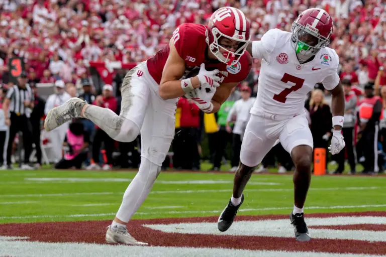 Indiana Hoosiers wide receiver Charlie Becker (80) makes a catch for a touchdown as Alabama Crimson Tide defensive back Dashawn Jones (7) chases after Thursday, Jan. 1, 2026, during the Rose Bowl and quarterfinal game of the College Football Playoff at Rose Bowl Stadium in Pasadena, Calif.