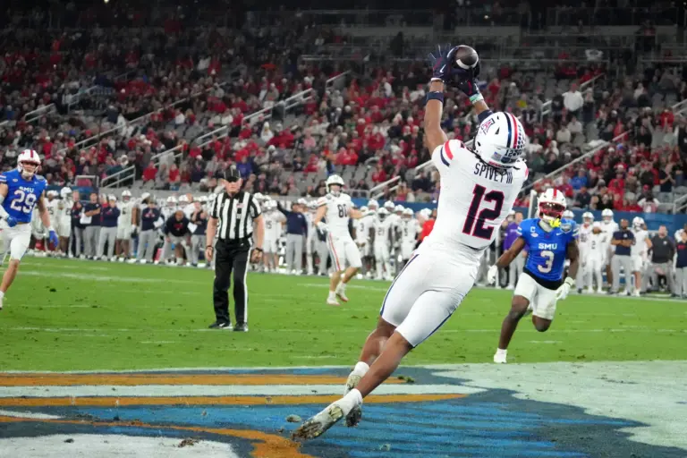 Jan 2, 2026; San Diego, CA, USA; Arizona Wildcats wide receiver Tre Spivey (12) catches a touchdown pass against the SMU Mustangs in the second half during the Holiday Bowl at Snapdragon Stadium. Mandatory Credit: Kirby Lee-Imagn Images