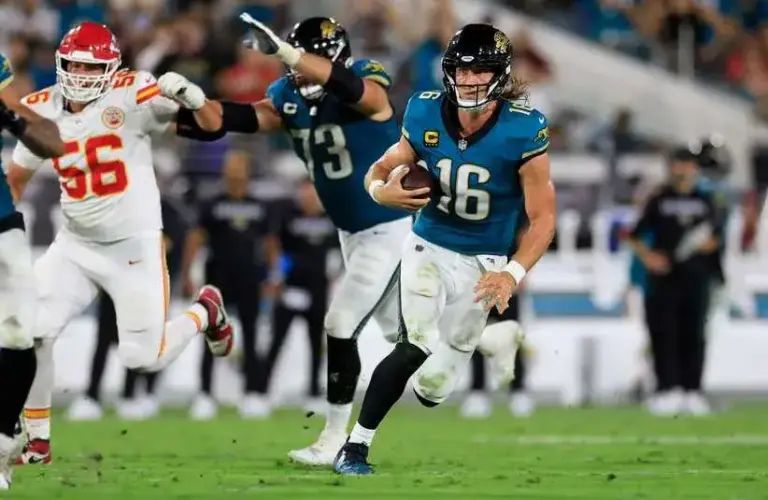 AFC Jacksonville Jaguars quarterback Trevor Lawrence (16) rushes for yards during the second quarter of an NFL football against the Kansas City Chiefs