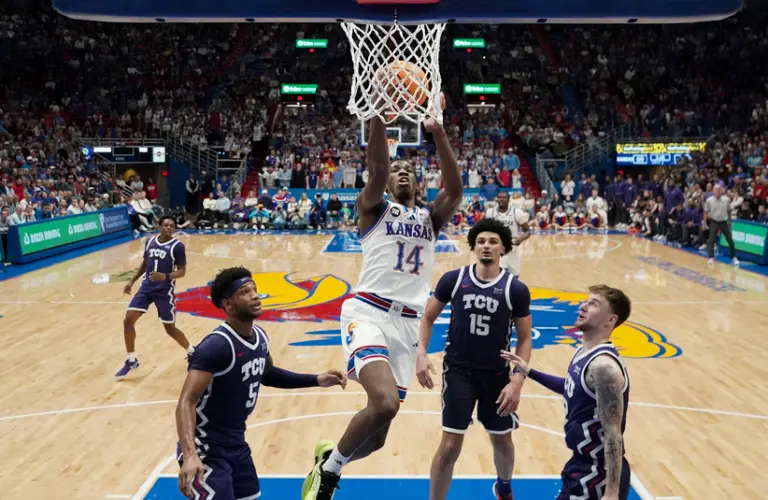 Kansas player scores basket on TCU.