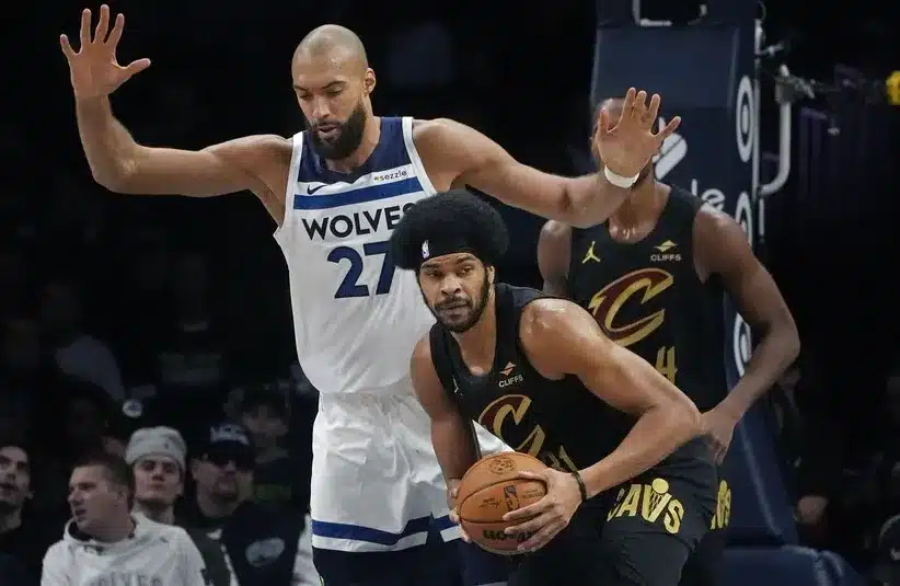 Cleland Cavaliers Center Jarrett Allen (31) looks to pass as Minnesota Timberwolves center Rudy Gobert (27) defends him.