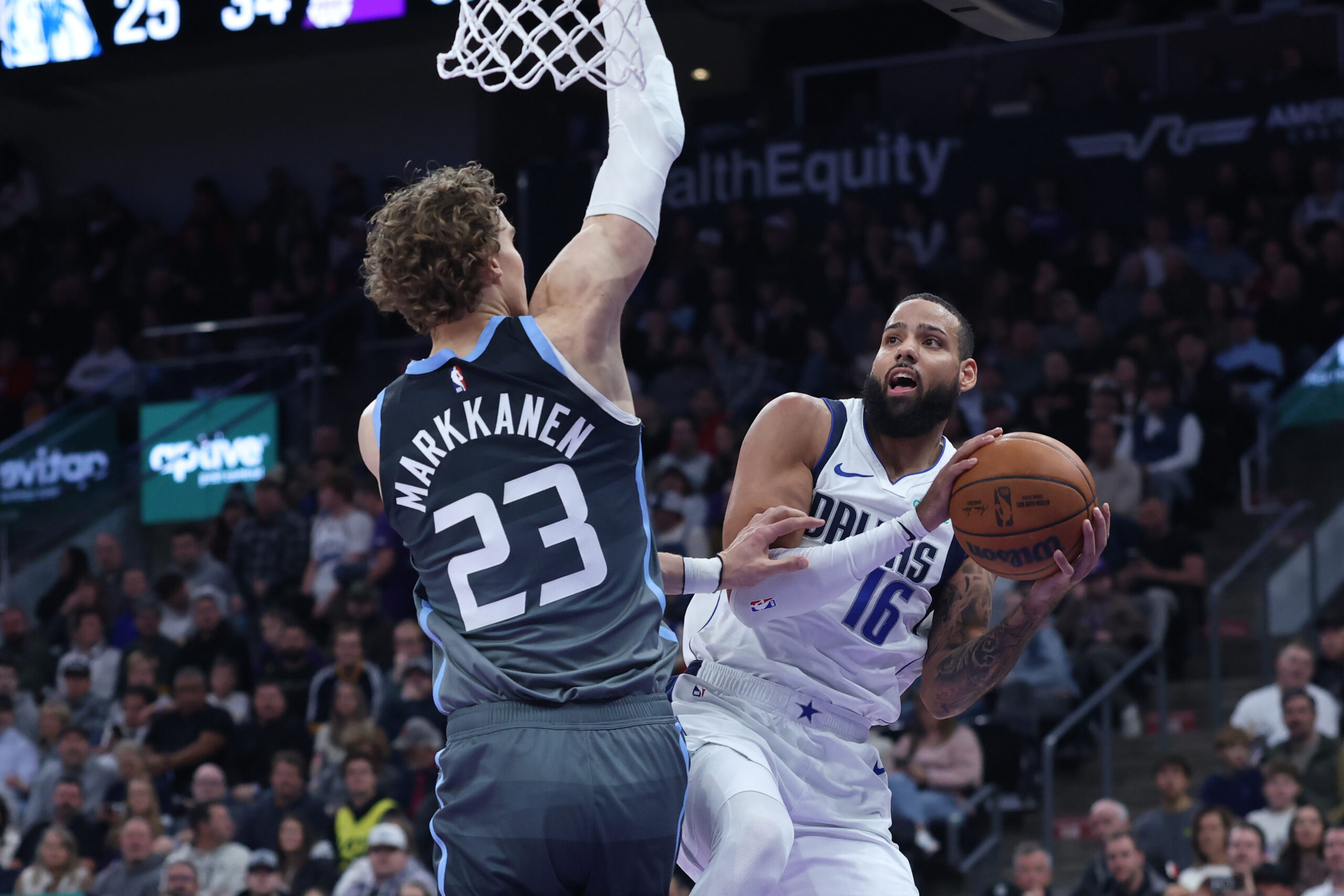 Caleb Martin and Jazz Lauri Markkanen