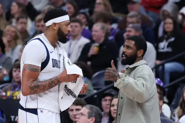 Jan 8, 2026; Salt Lake City, Utah, USA; Dallas Mavericks forward Anthony Davis (l3) and guard Kyrie Irving (right) speak during a second half break in action against the Utah Jazz at Delta Center.