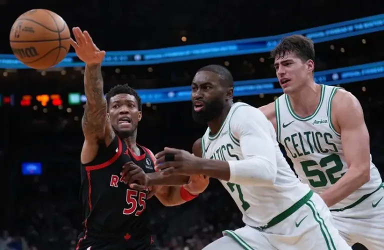 Toronto Raptors guard Alijah Martin (55) works for the ball against Boston Celtics guard Jaylen Brown (7) in the second half.