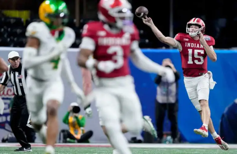 Indiana QB Fernando Mendoza attempts a pass in Peach Bowl.
