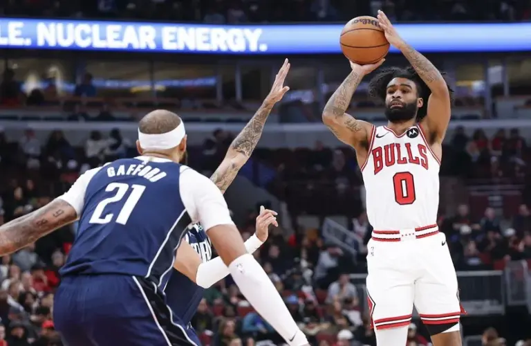 Chicago Bulls guard Coby White (0) shoots against the Dallas Mavericks during the first half at United Center.