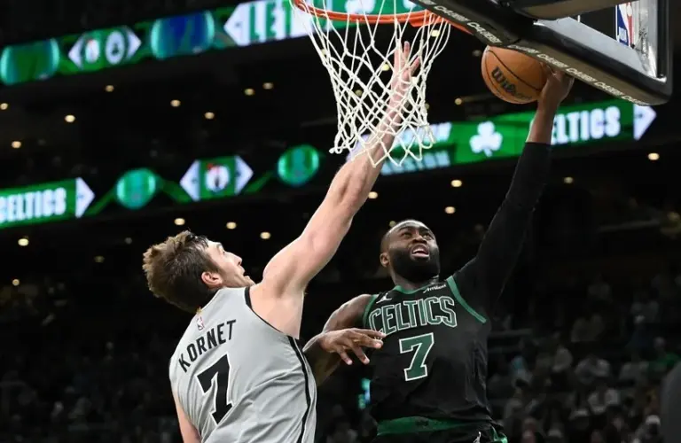 San Antonio Spurs center Luke Kornet (7) defends Boston Celtics guard Jaylen Brown (7) during the second half at the TD Garden.