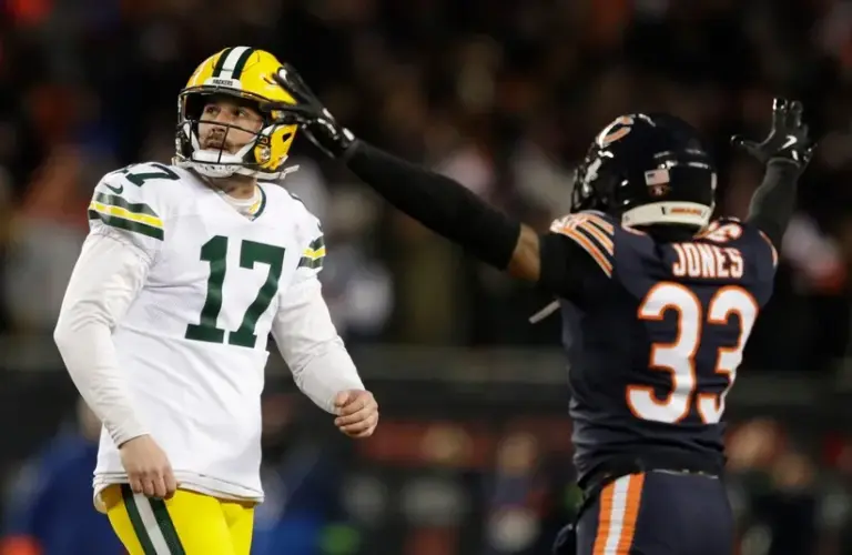 Green Bay Packers place kicker Brandon McManus (17) reacts to missing a field goal late in the fourth quarter as Chicago Bears cornerback Jaylon Jones (33) celebrates.