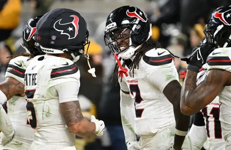 Houston Texans safety Calen Bullock (2) and safety Jalen Pitre (5) celebrate after a play during the second half of an AFC Wild Card Round game of the NFL playoffs against the Pittsburgh Steelers