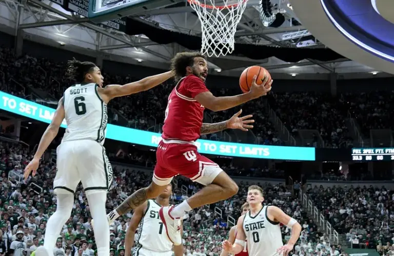 Indiana Hoosiers guard Tayton Conerway (6) shoots the ball past Michigan State Spartans forward Jordan Scott (6) during the first half at Jack Breslin Student Events Center.