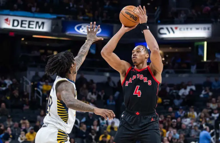 Toronto Raptors forward/guard Scottie Barnes (4) shoots the ball while Indiana Pacers guard Quenton Jackson (29) defends in the first half at Gainbridge Fieldhouse